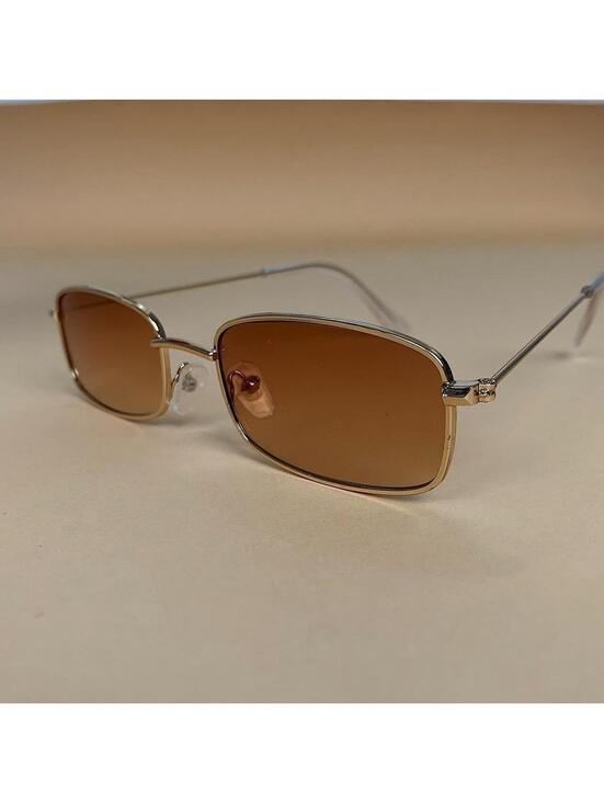 Accessories - Brown and gold slim sunglasses. Brown trim with brown lenses. Glasses are
